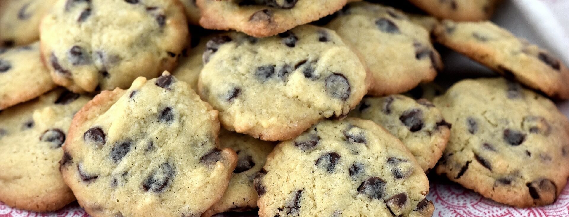 piles of vegan chocolate chip cookies, perfect recipe for lactose intolerant people and those with dairy allergies.